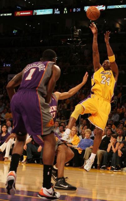 Kobe Bryant hits a fade away jumper over the Phoenix Suns. 